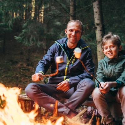 Father and son roasting marshmallows