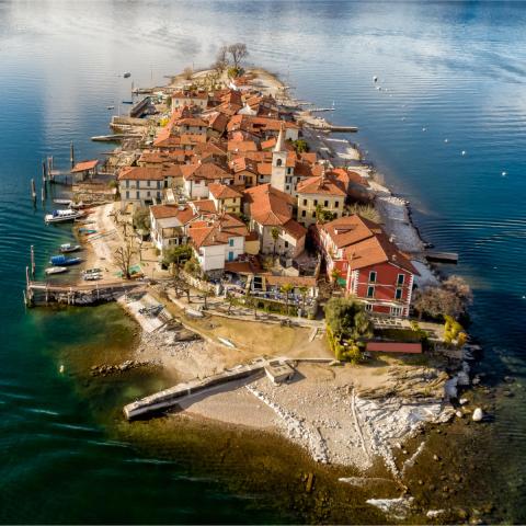 a body of water with a city in the background