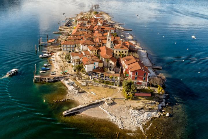 a body of water with a city in the background