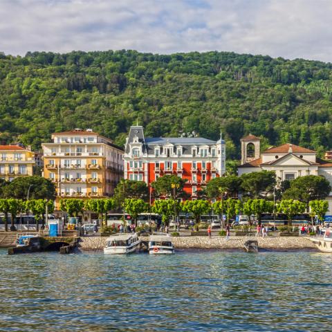 a small boat in a harbor next to a body of water