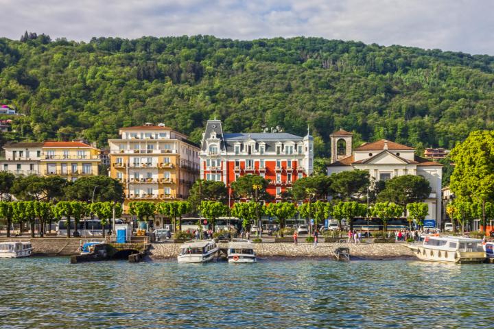 a small boat in a harbor next to a body of water