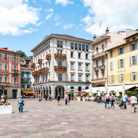 a group of people walking in front of a building