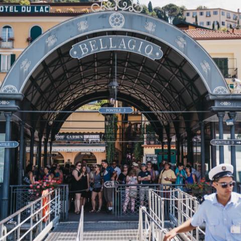 a man sitting on a bench in front of a building