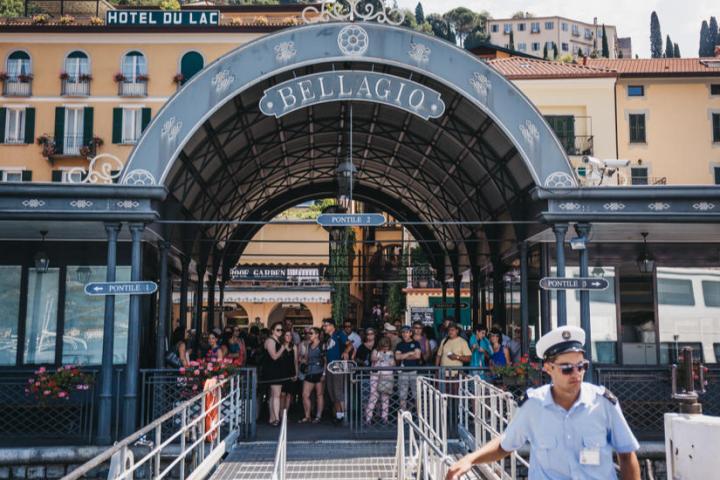 a man sitting on a bench in front of a building