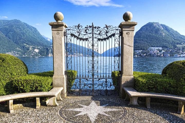 a bridge over a body of water with a mountain in the background