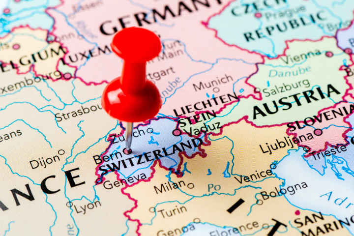 Map with red pin marking Switzerland, showing nearby countries and cities in Europe.